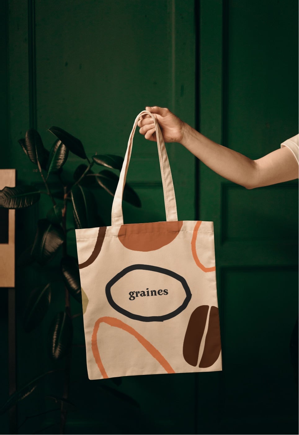 Tote bag en toile crème portant le logotype Graines — café de spécialité et tartines à Paris 6e